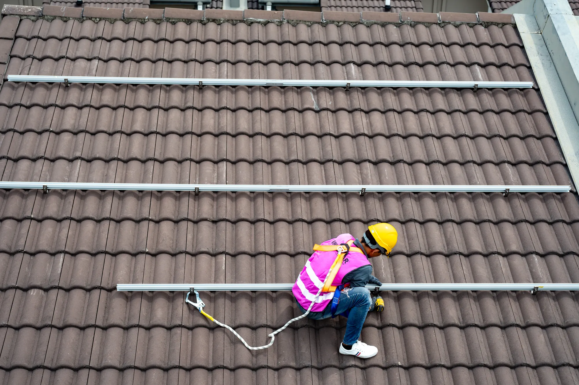 Solar rails laid across a tiled roof