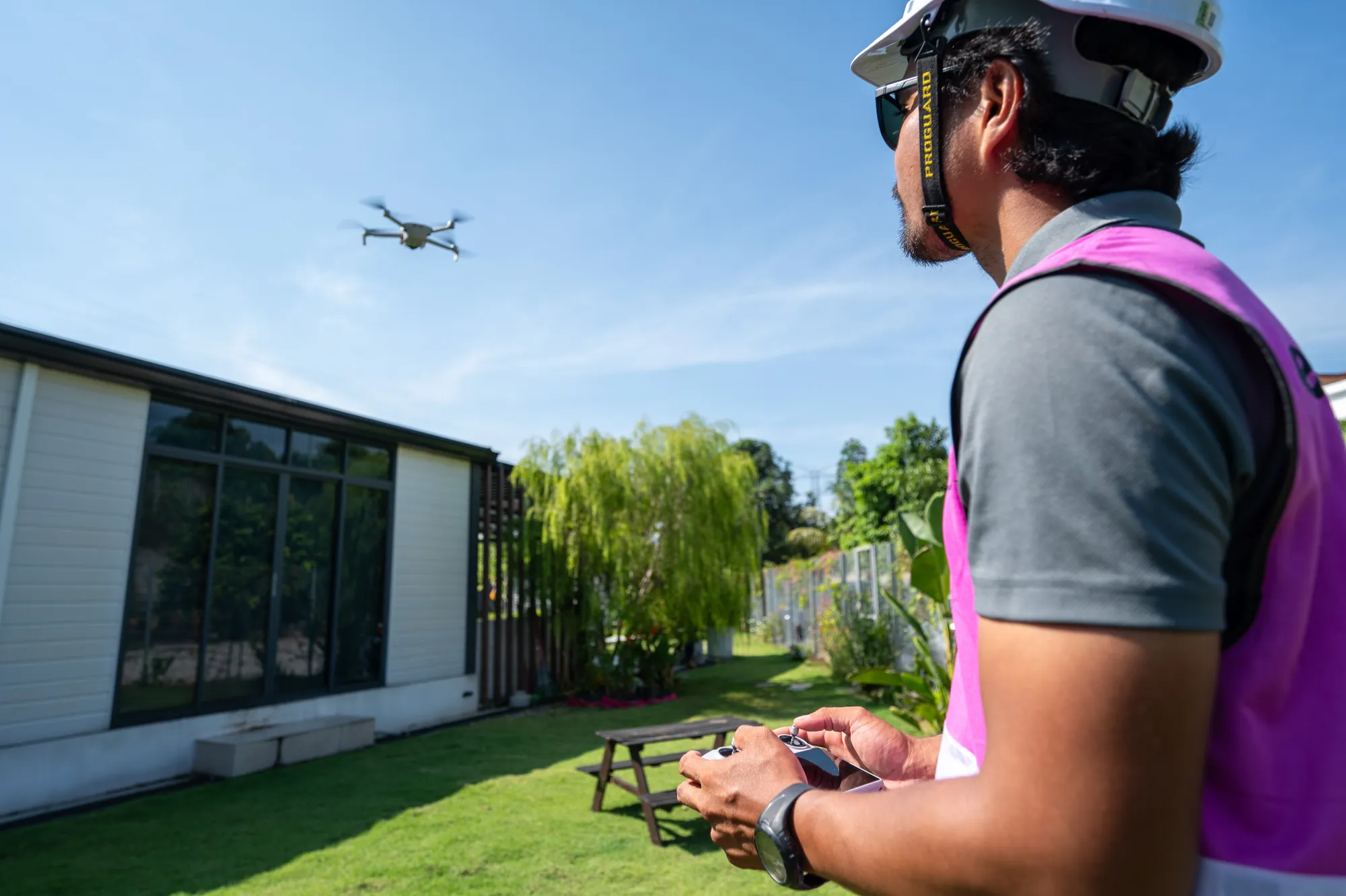 Our team flying a drone over the roof